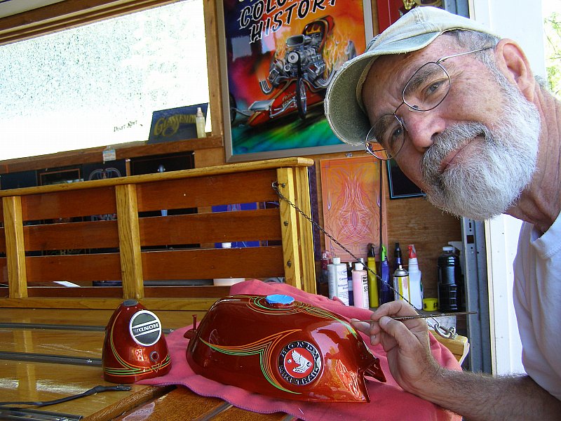 Famed artist Alan Johnson (Alan Johnson Graphics)  put the finally touches on the another kustom Z50 tank and headlight.
