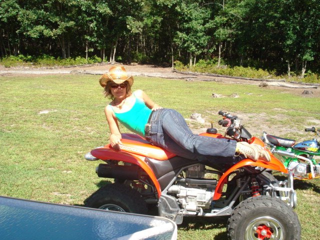 Karen of Crooklyn posing for the camera.
Greetings, Honda Enthusiasts - Whenever I need a little R&R from massaging stressed-out New Yorkers,  you'll find me at the Hondarosa ridin' on a mini, screaming like a banshee in the woods.   Yeee-Haww!
