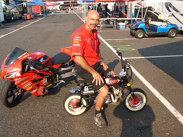 Honda's Kent Stotz "Mr. 200 MPH"  aboard the Rat Rod for a cruise thru the pits.
